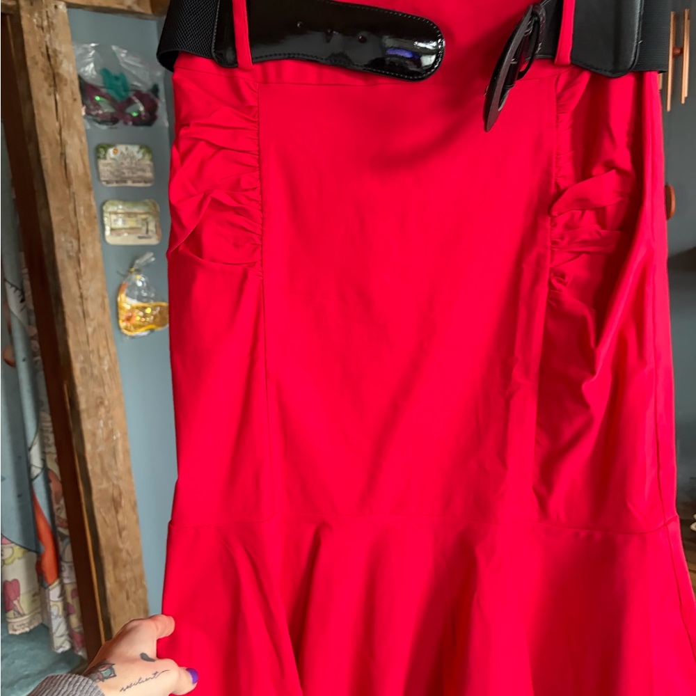 Bright Red Ruffled Hem pencil skirt with black belt.